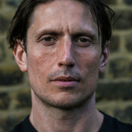 A headshot of Morgan from How to Fight Loneliness