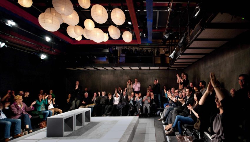 Inside the Park 90 Theatre with the audience clapping after a performance.